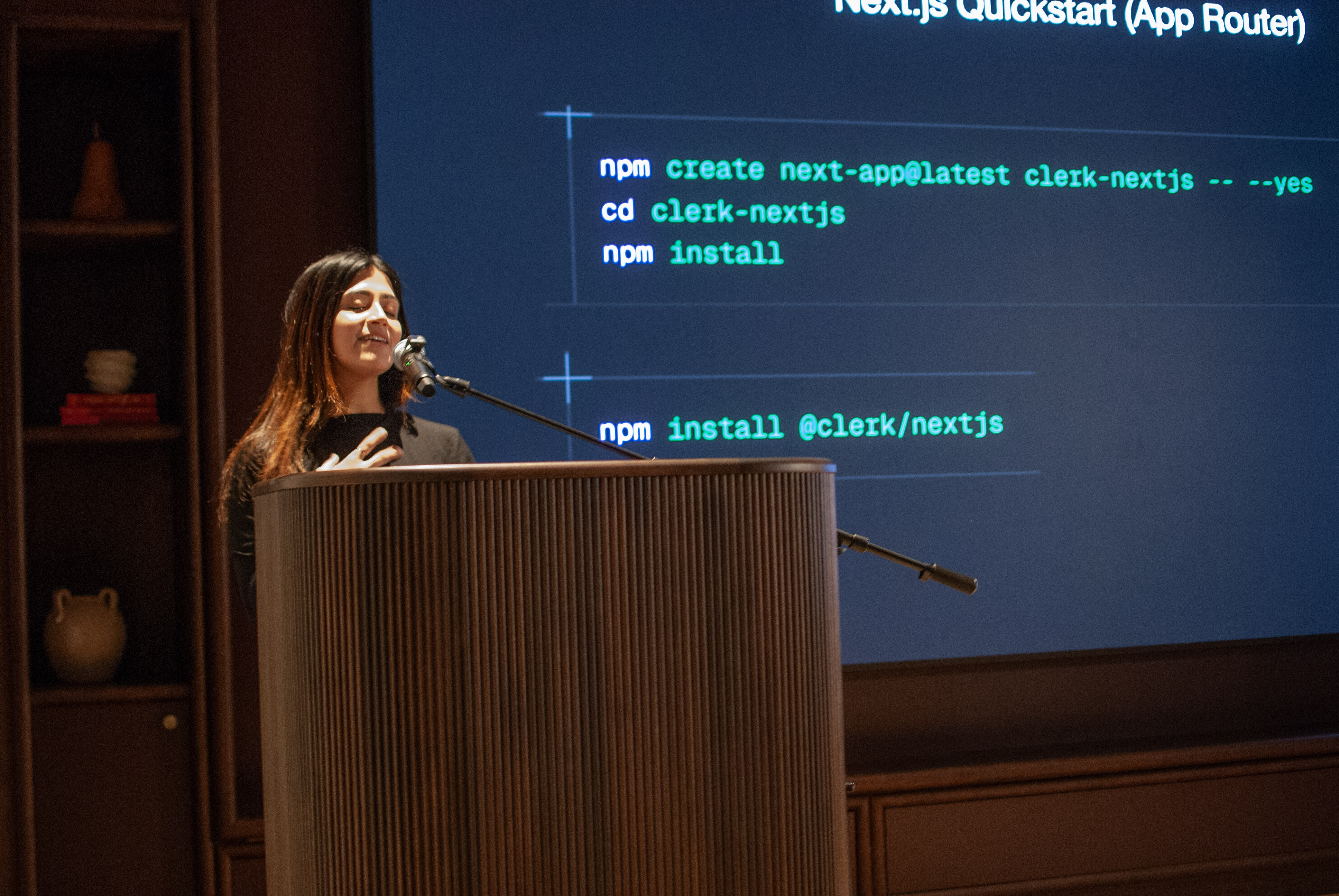 Speaking on stage at an event