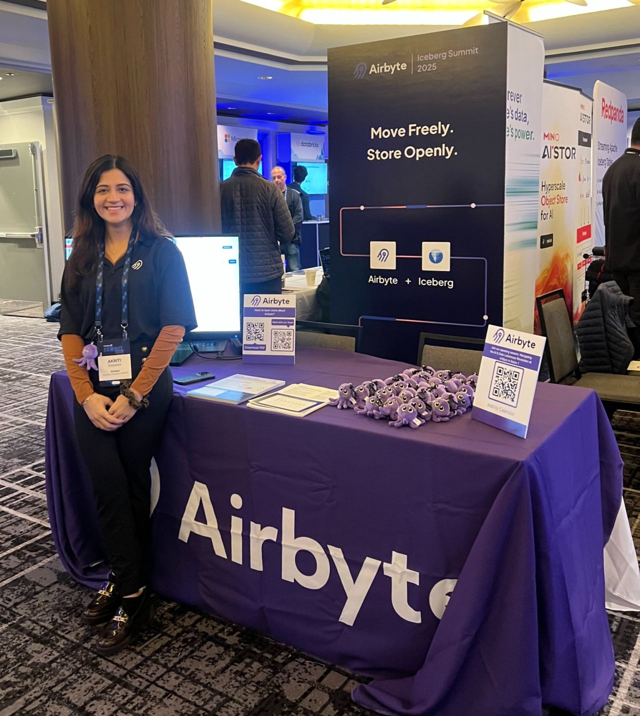 Akriti at Airbyte booth during Iceberg Summit 2025